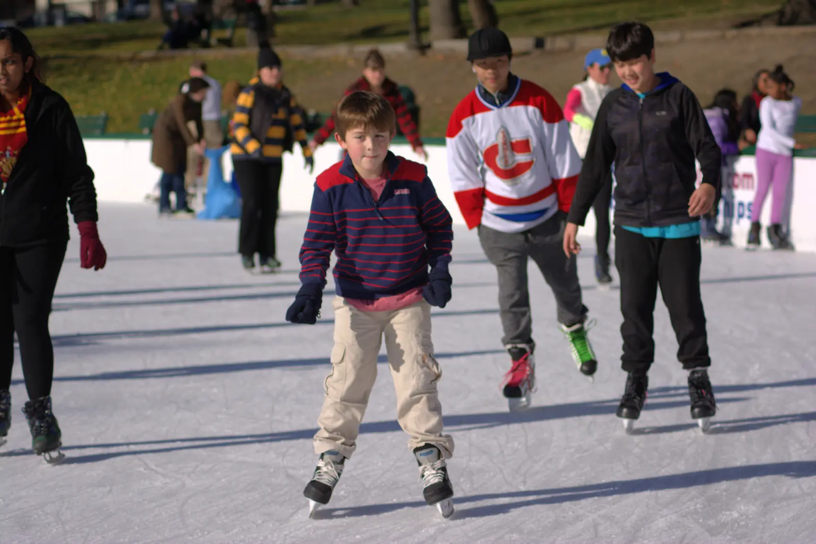 Ice skaters on the frog pond at Boston Common in winter