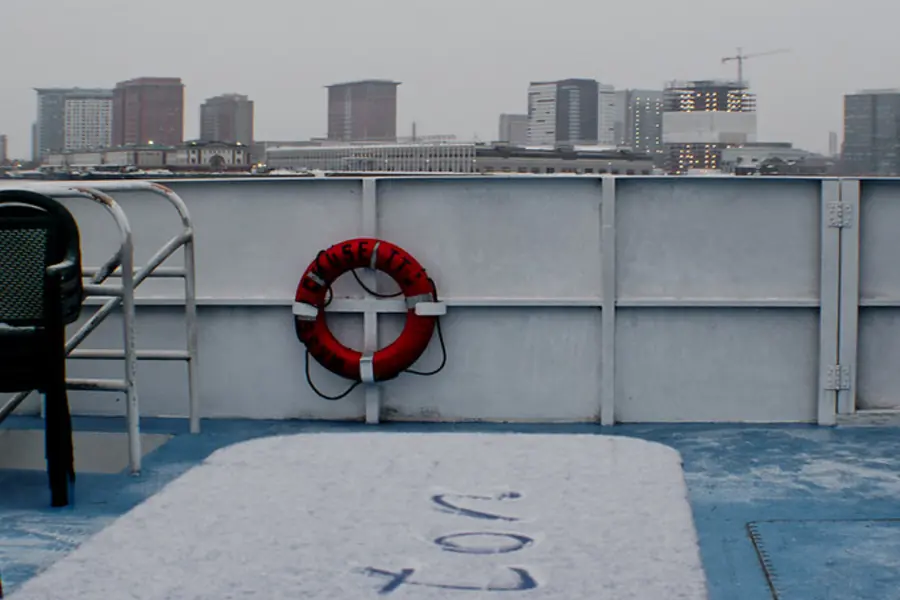 A life-buoy ring on a snow-covered rooftop